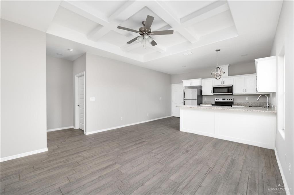 1804 Stauffer Street Weslaco, TX 78596 - Photo 3 of 23 a view of kitchen with sink and wooden floor