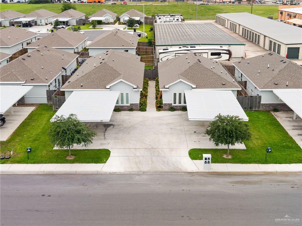 1804 Stauffer Street Weslaco, TX 78596 - Photo 4 of 17 an aerial view of residential houses with outdoor space and parking