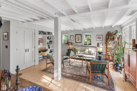 a living room with lots of furniture and a table