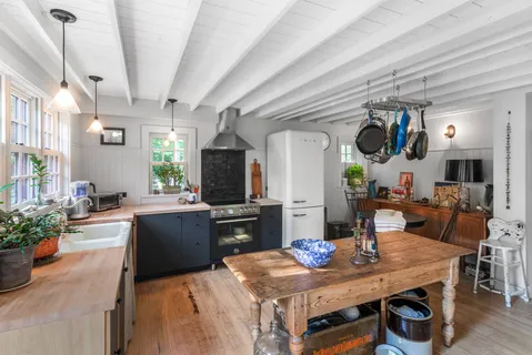 a view of kitchen and dining area with furniture