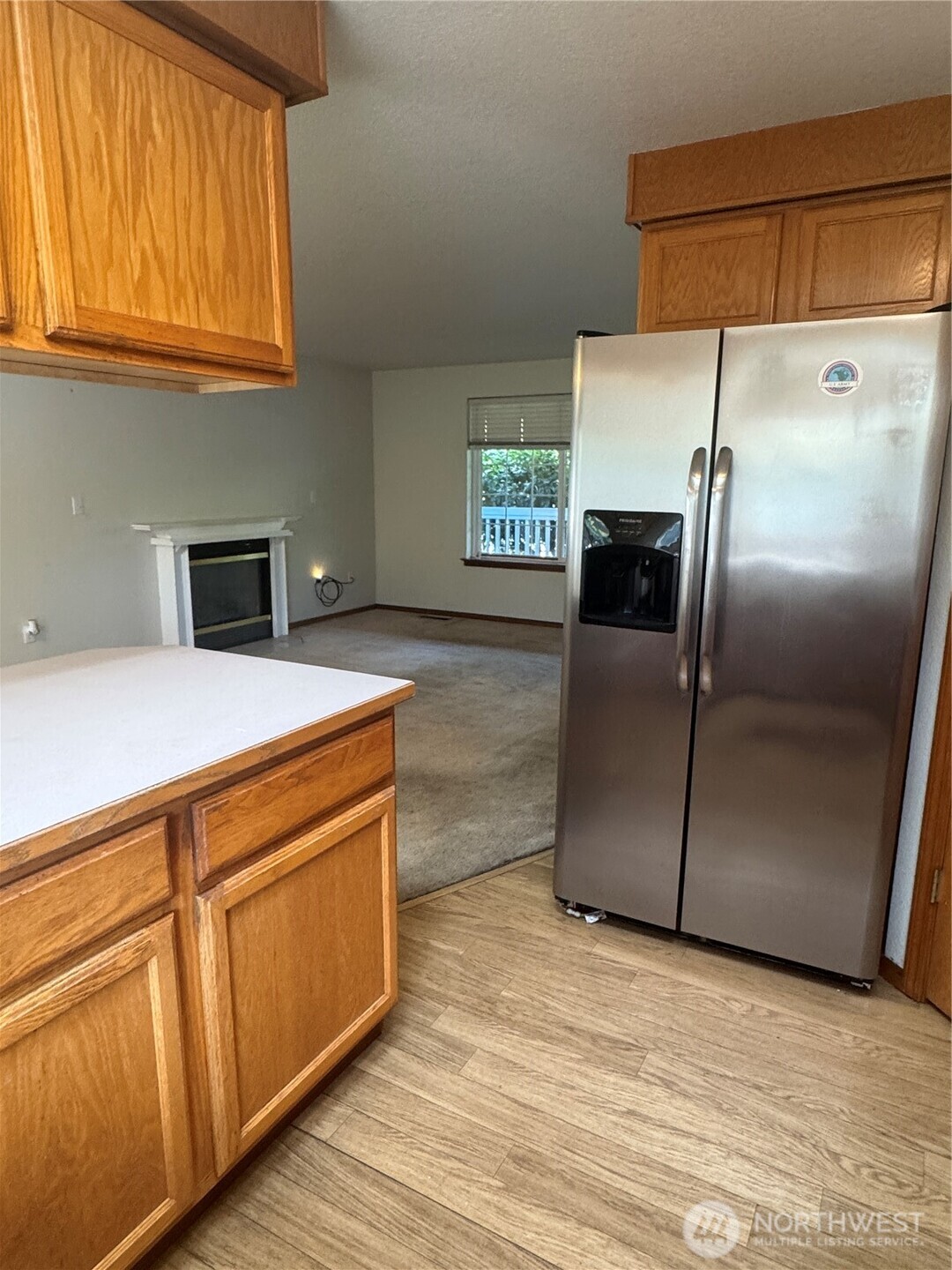 5920 Compton Loop Southeast Lacey, WA 98513 - Photo 12 of 37 a kitchen with stainless steel appliances granite countertop a refrigerator a stove and a sink