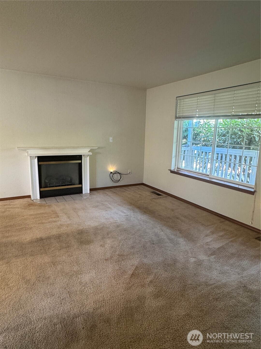 5920 Compton Loop Southeast Lacey, WA 98513 - Photo 16 of 37 a view of an empty room with a window and fire place