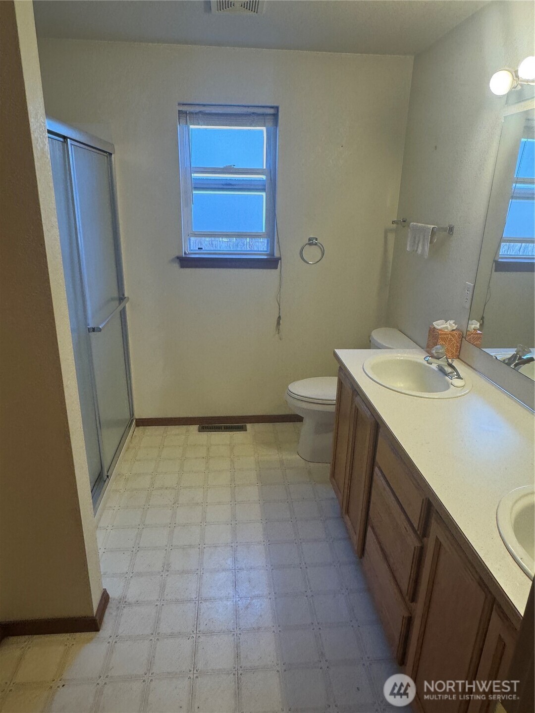 5920 Compton Loop Southeast Lacey, WA 98513 - Photo 23 of 37 a bathroom with a sink a toilet and a mirror