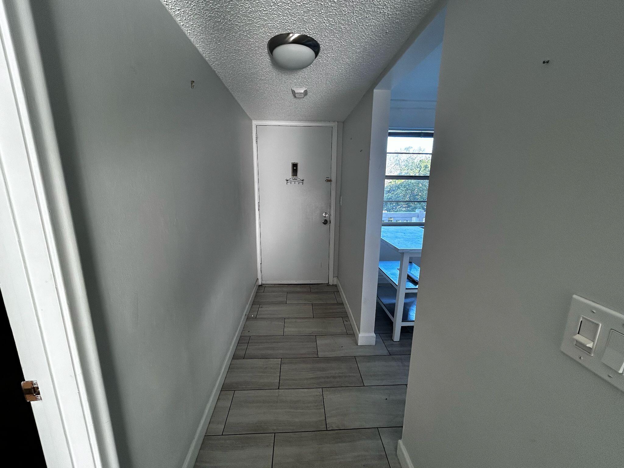 3776 Inverrary Boulevard, Unit 304R Lauderhill, FL 33319 - Photo 3 of 23 a view of a hallway