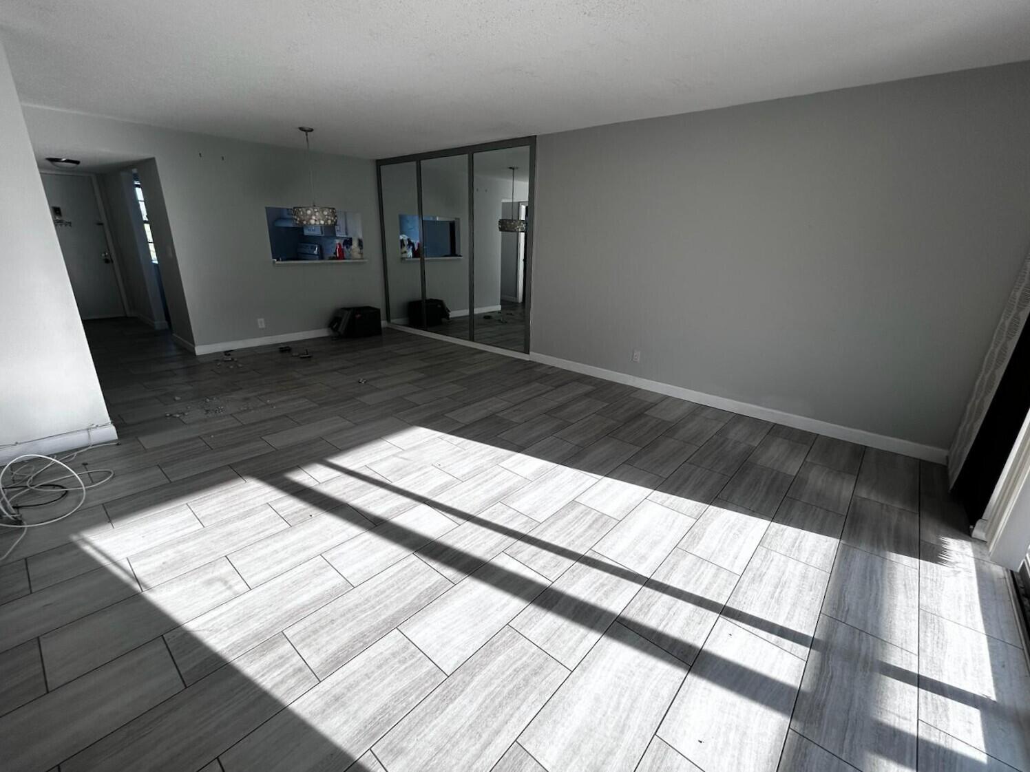 3776 Inverrary Boulevard, Unit 304R Lauderhill, FL 33319 - Photo 8 of 23 a view of an empty room and wooden floor