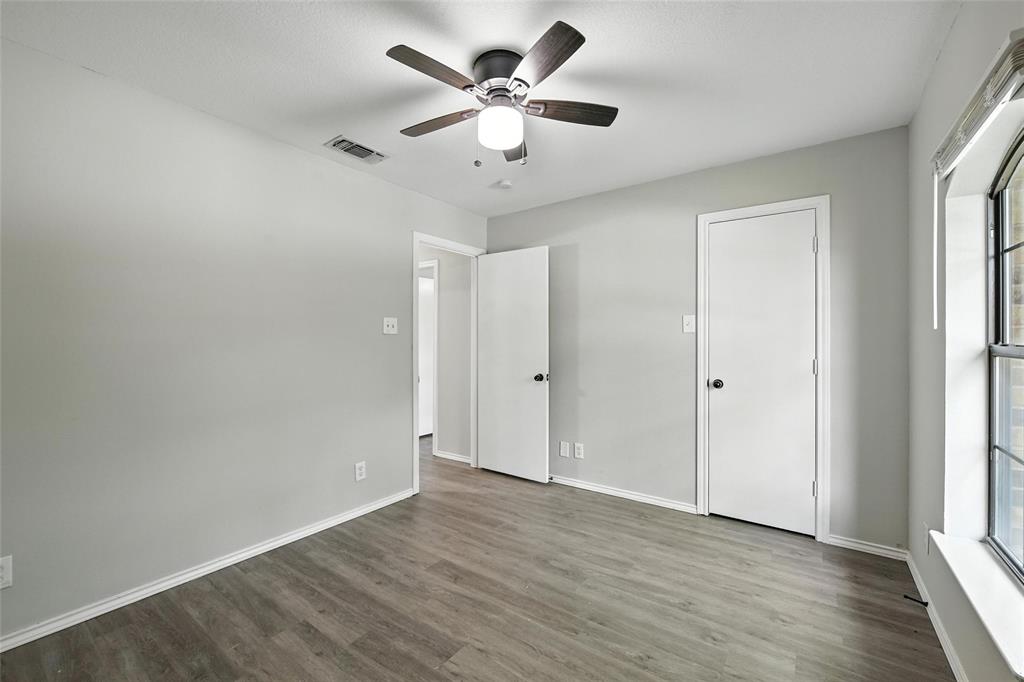 602 Valleyridge Court Decatur, TX 76234 - Photo 16 of 27 wooden floor in an empty room with a window