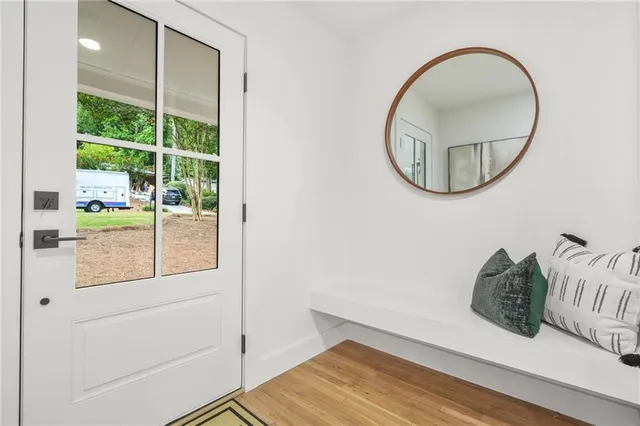 a view of a livingroom with furniture and wooden floor