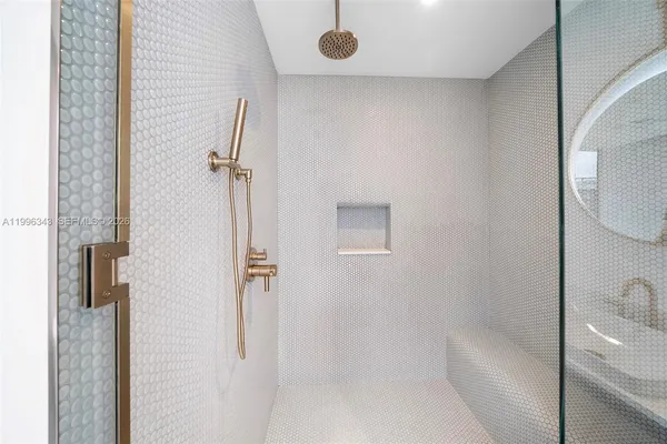 a bathroom with a sink vanity mirror and toilet