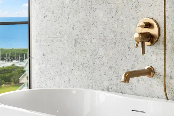a bathroom with a sink mirror and toilet