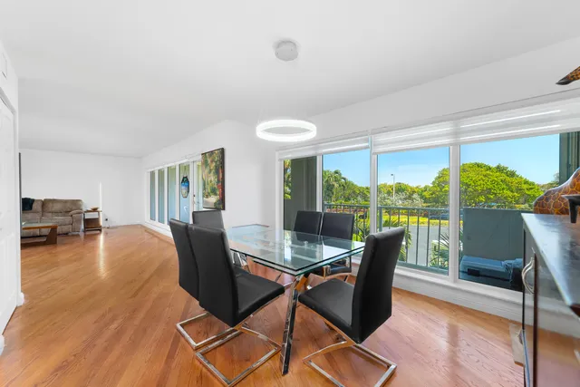 a large kitchen with stainless steel appliances granite countertop a stove and a sink