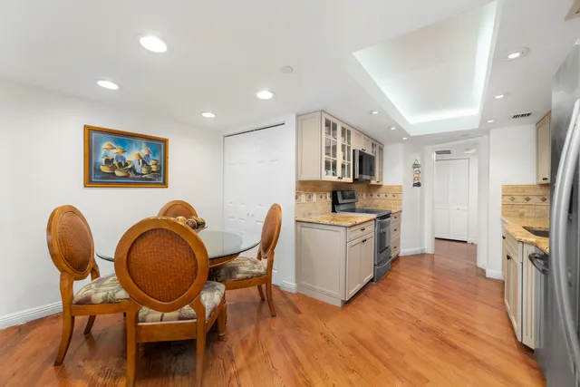 a view of a livingroom with workspace and a couch