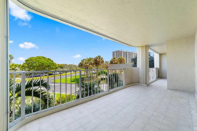 a view of a dining room with furniture and a window