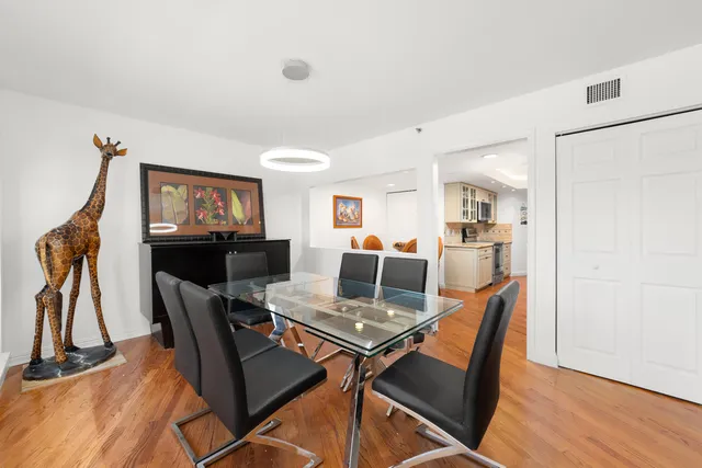 a kitchen with stainless steel appliances a stove sink microwave and cabinets