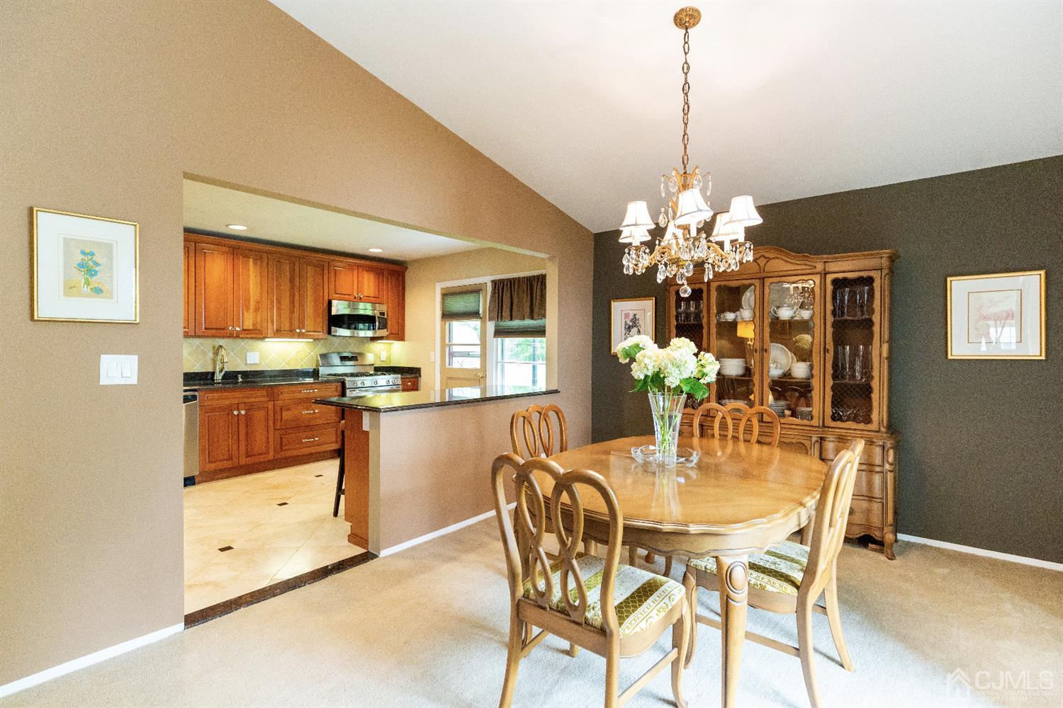 20 Gales Road Edison, NJ 08837 - Photo 14 of 45 a dining room filled chandelier and kitchen view