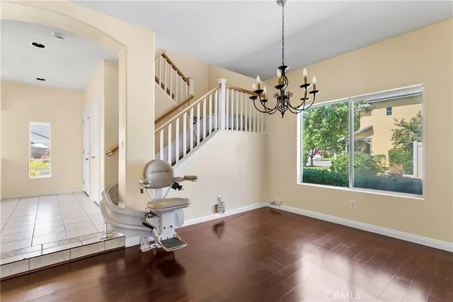 a kitchen with stainless steel appliances granite countertop a stove top oven a sink dishwasher and a refrigerator