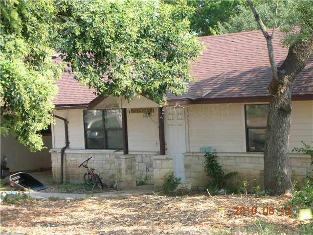 4811-4813 Doss Road Austin, TX 78734 - Photo 1 of 1 a front view of a house with garden