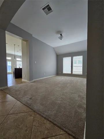 a view of empty room with windows