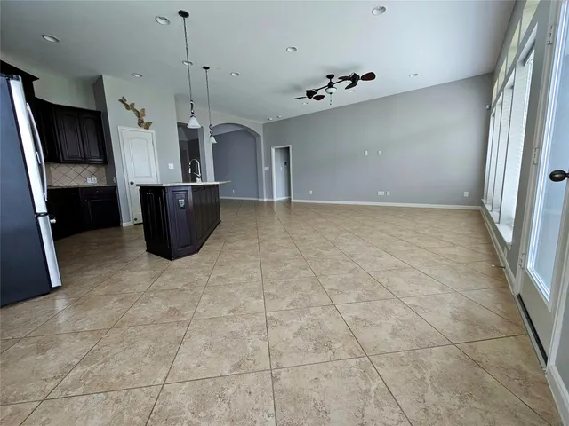 a view of a livingroom with a refrigerator