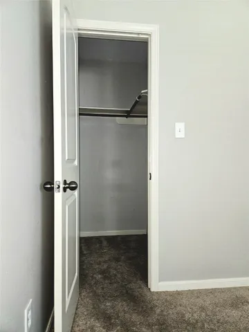 a view of a room with a white door