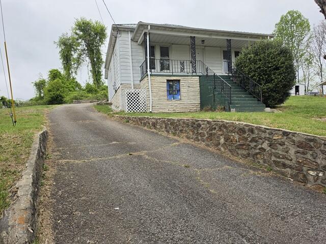 170 10th Street Fieldale, VA 24089 - Photo 5 of 37 a front view of a house with garden