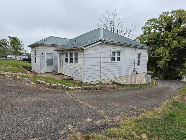 170 10th Street Fieldale, VA 24089 - Photo 9 of 37 a front view of a house with a yard and garage