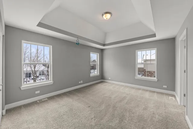 a view of an empty room with windows