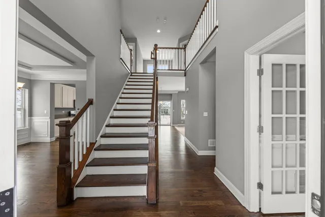 a view of an entryway with wooden floor and windows
