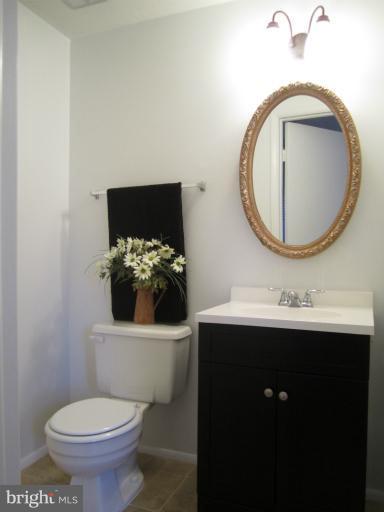 6226 Hillside Road Springfield, VA 22152 - Photo 11 of 30 a bathroom with a toilet sink and mirror