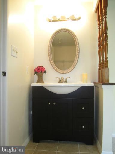 6226 Hillside Road Springfield, VA 22152 - Photo 9 of 30 a bathroom with a sink and a mirror