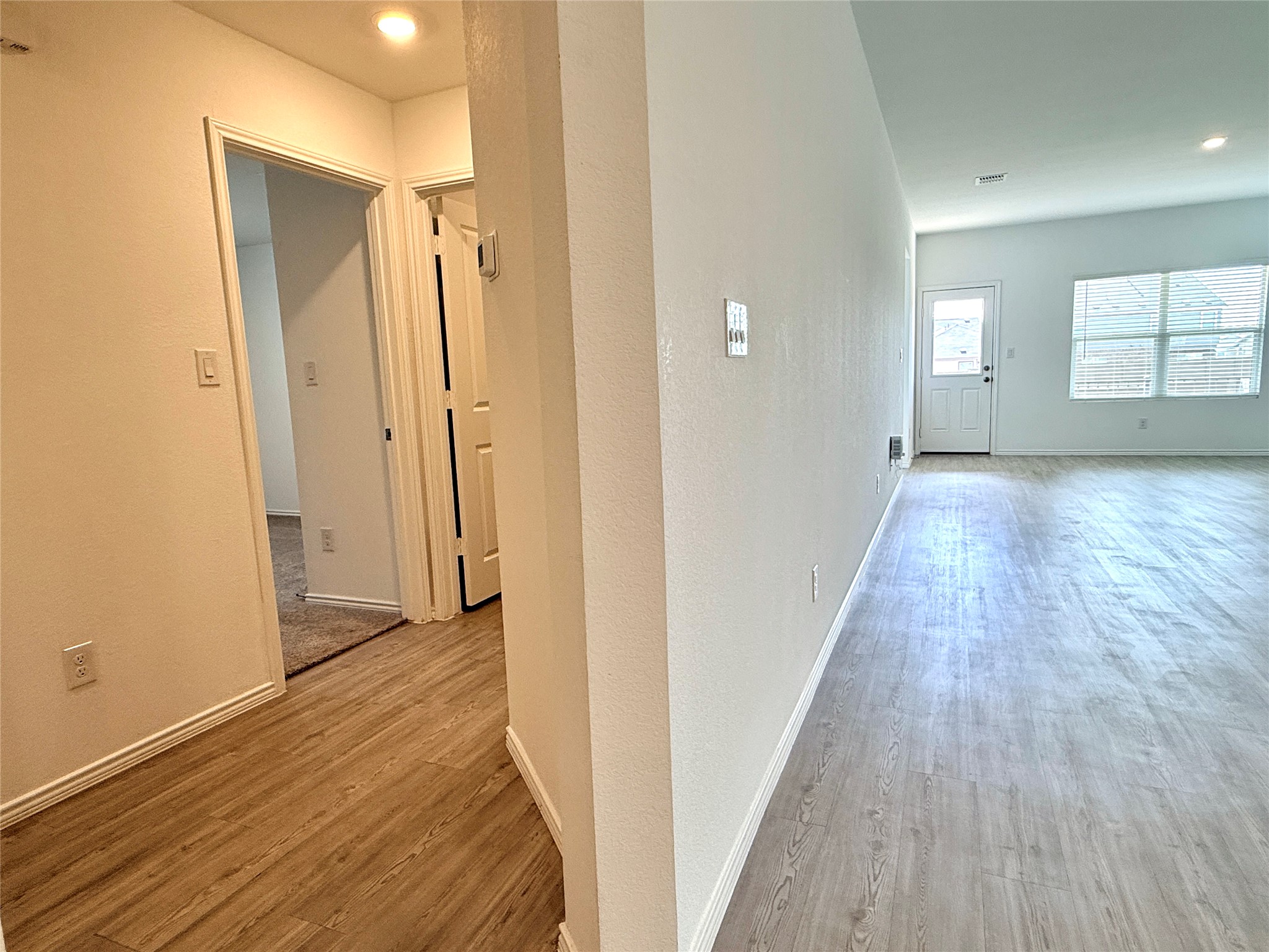 289 Sormonne Loop Kyle, TX 78640 - Photo 11 of 32 Hall with light wood finished floors and recessed lighting