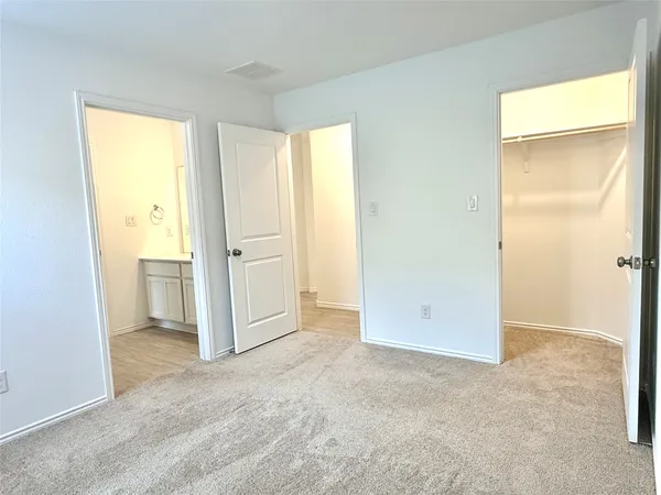 a view of a room with wooden floor and window