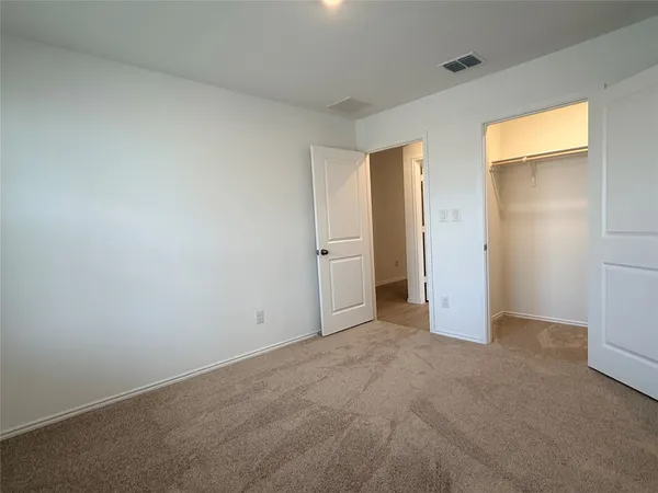 a kitchen with stainless steel appliances a refrigerator sink and microwave