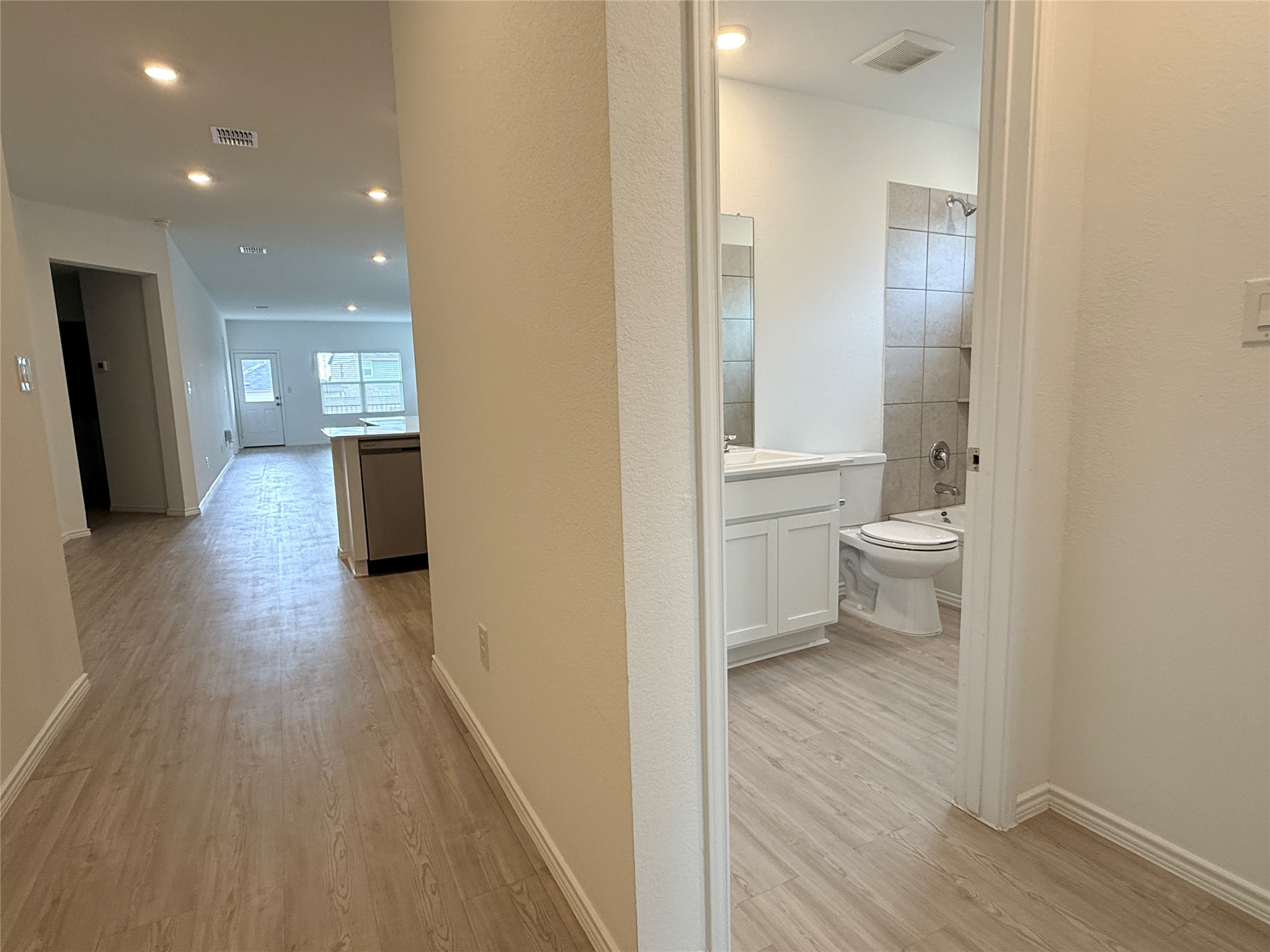 289 Sormonne Loop Kyle, TX 78640 - Photo 21 of 32 Hall featuring light wood-type flooring and recessed lighting