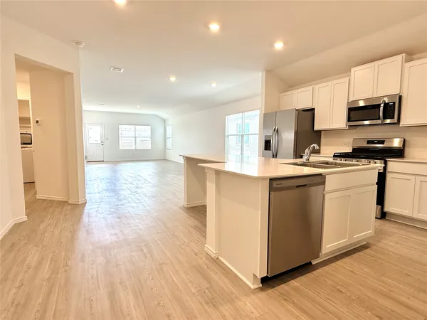 a white bath tub sitting next to a shower