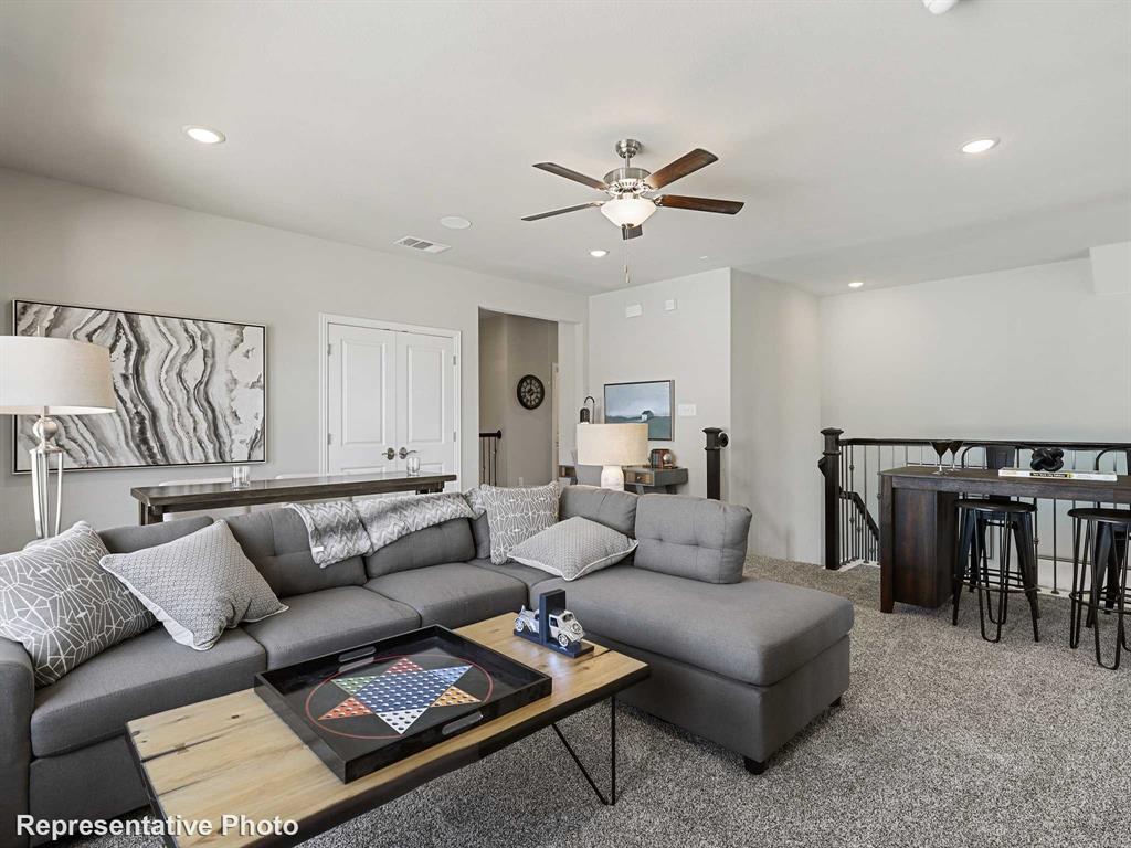 1143 Rothland Lane Red Oak, TX 75154 - Photo 11 of 18 Spacious bonus room featuring plush carpet flooring, recessed lighting, and a ceiling fan