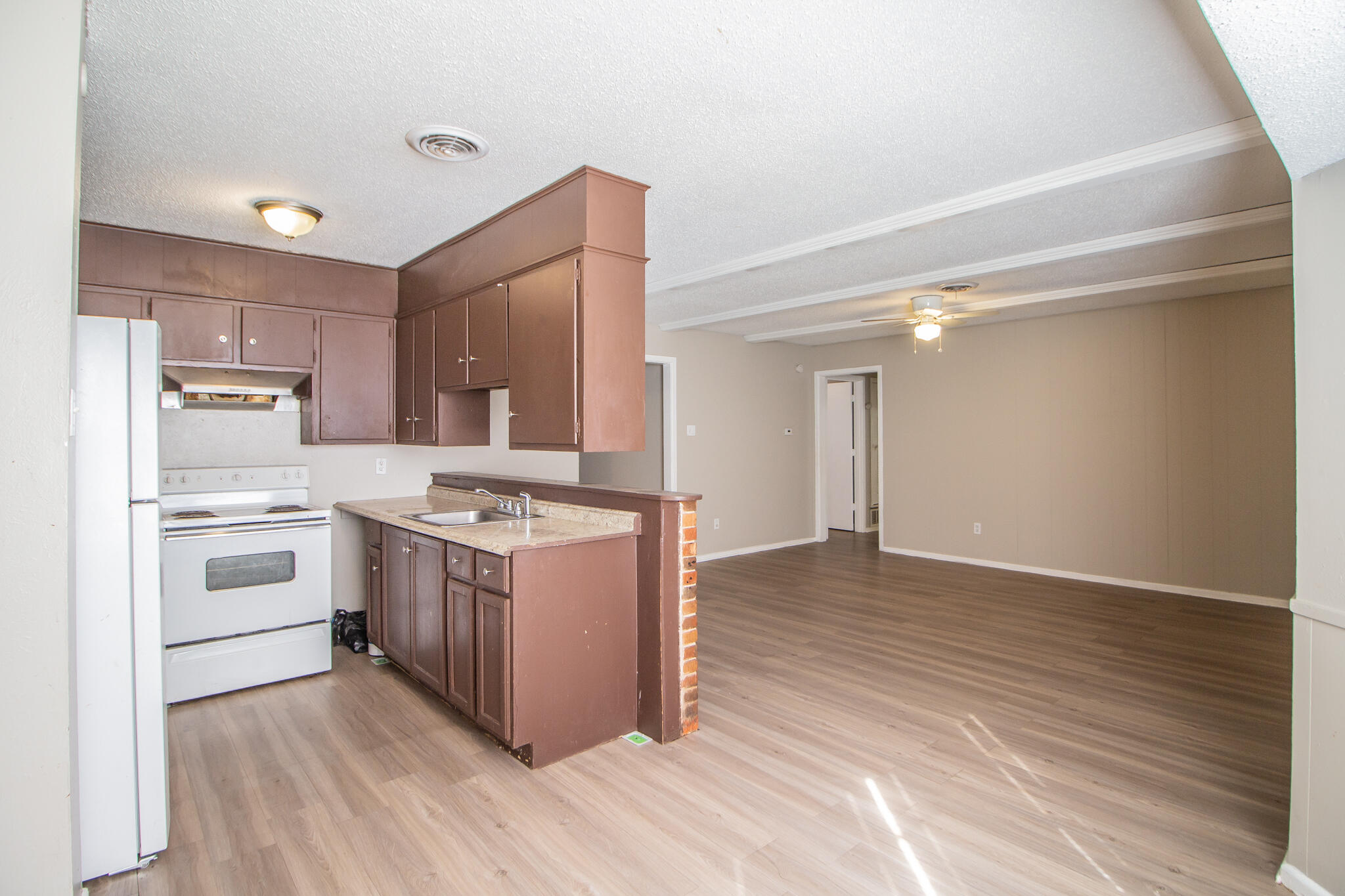 1903 71st Street Lubbock, TX 79412 - Photo 12 of 23 a kitchen with stainless steel appliances granite countertop a stove and a refrigerator