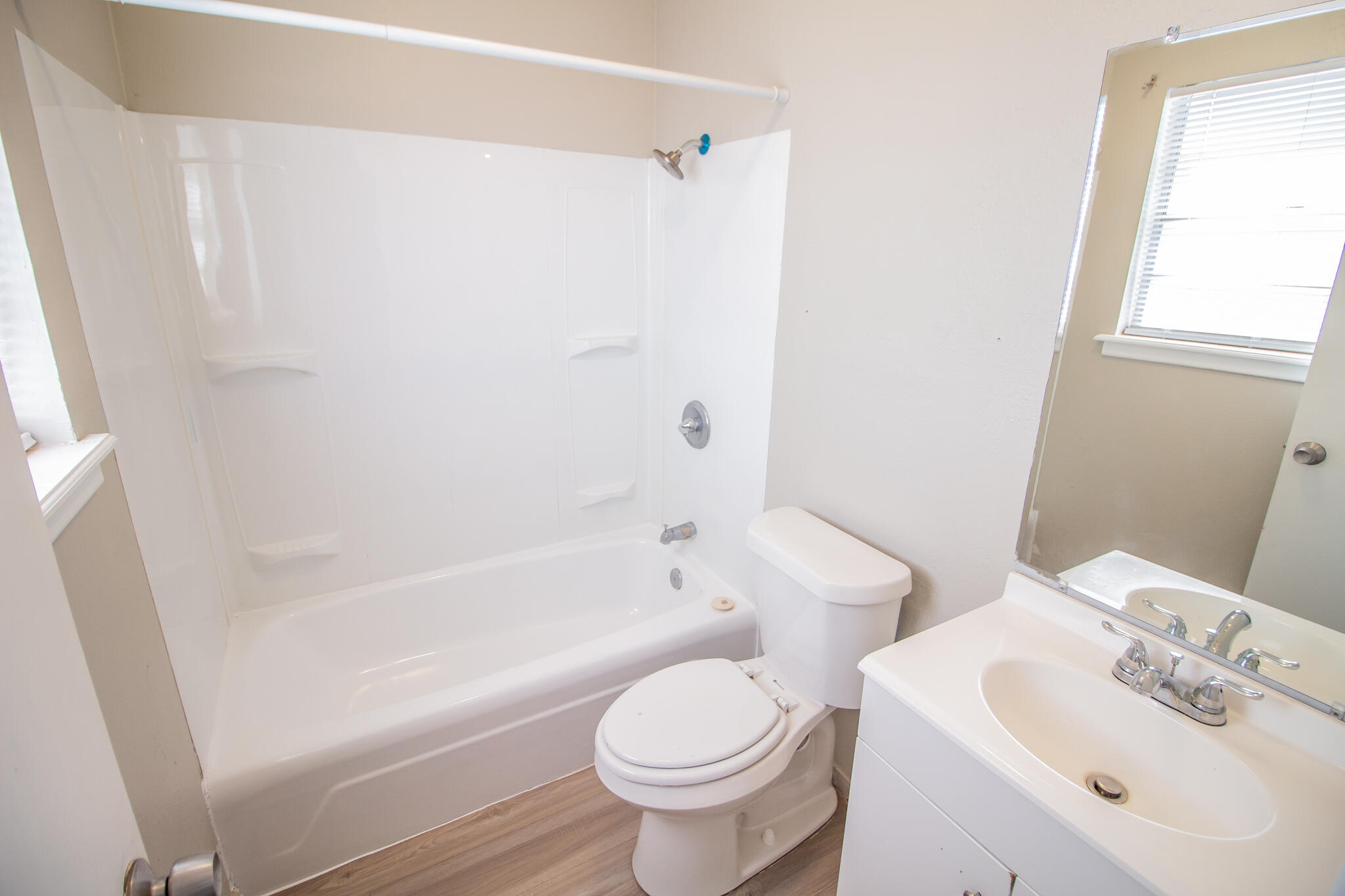 1903 71st Street Lubbock, TX 79412 - Photo 14 of 23 a bathroom with a sink toilet and shower