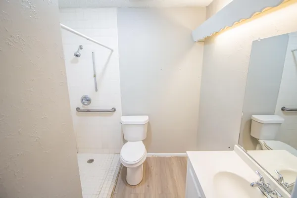 a bathroom with a toilet and a sink