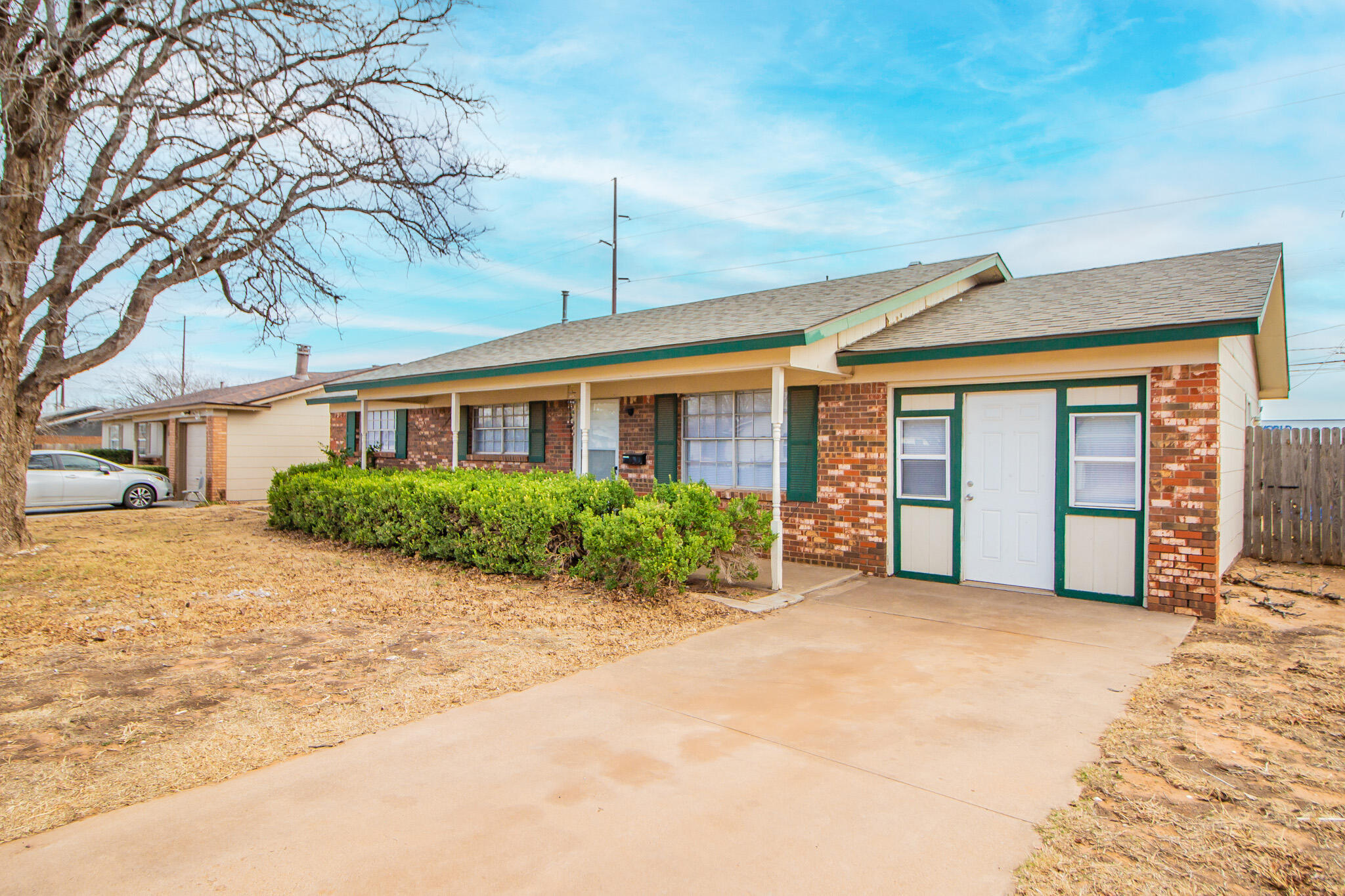 1903 71st Street Lubbock, TX 79412 - Photo 2 of 23 a front view of a house with garden