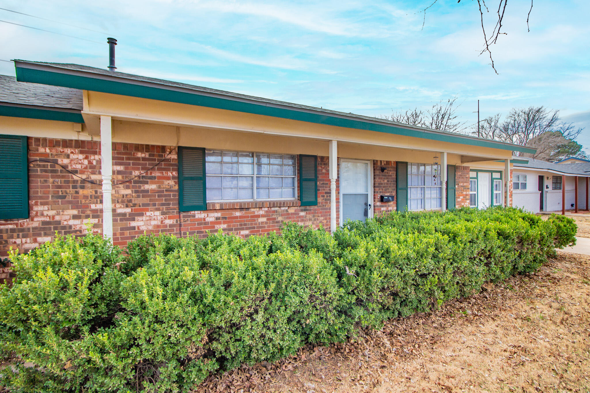 1903 71st Street Lubbock, TX 79412 - Photo 3 of 23 a front view of a house with garden
