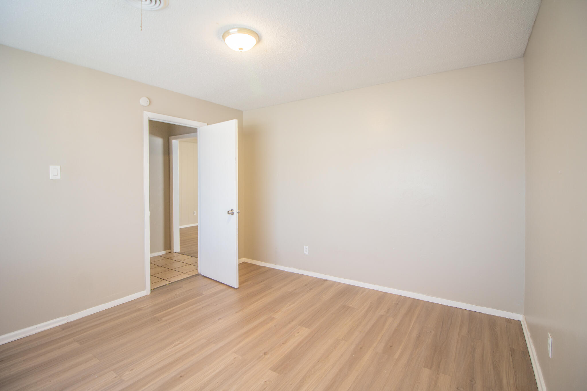 1903 71st Street Lubbock, TX 79412 - Photo 4 of 23 an empty room with wooden floor