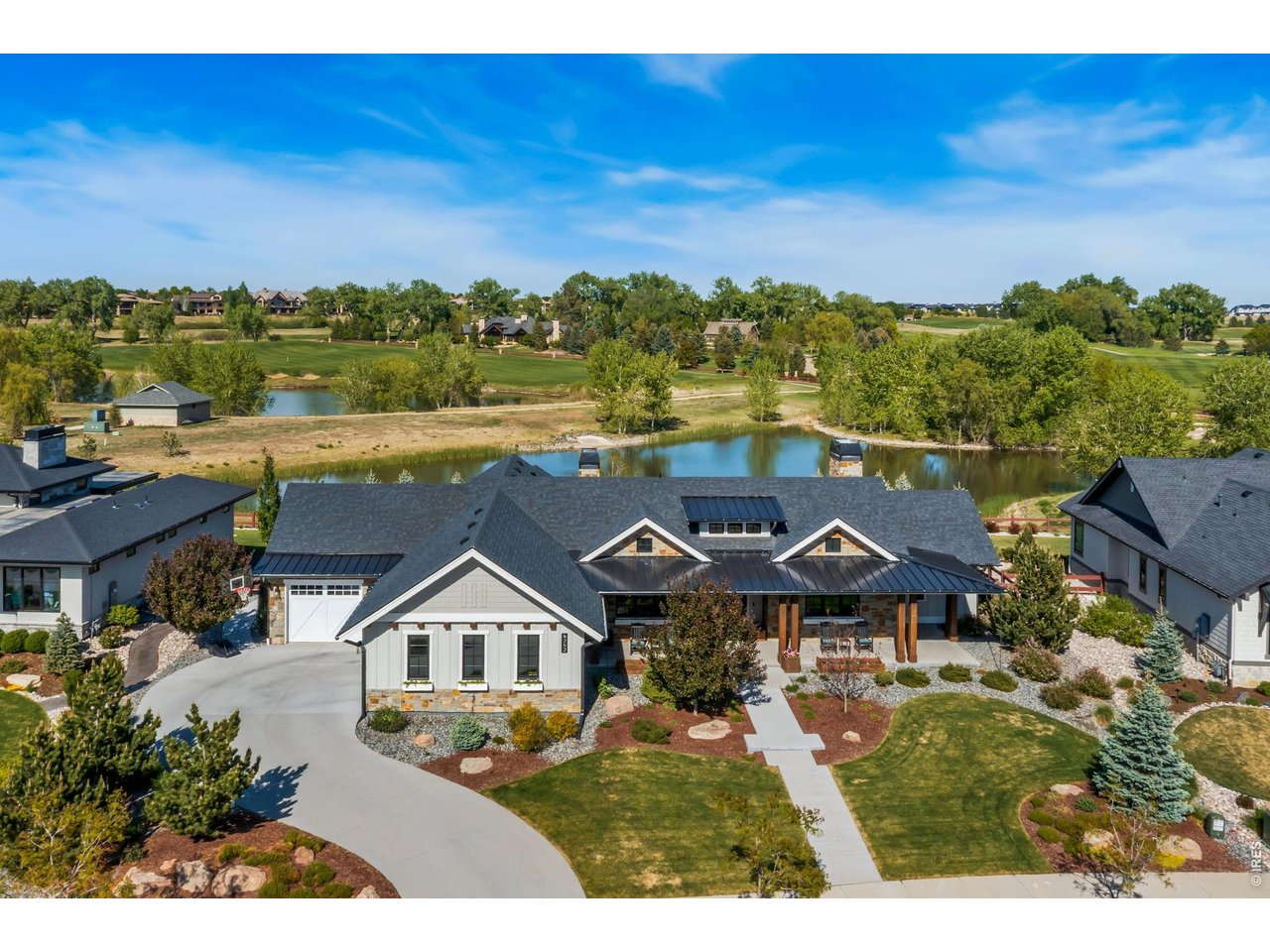 4252 Mountain Shadow Way Timnath, CO 80547 - Photo 1 of 49 Water front, luxury, custom home located in the beautiful Harmony Club neighborhood.