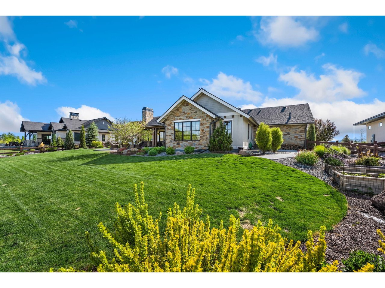 4252 Mountain Shadow Way Timnath, CO 80547 - Photo 46 of 49 Impressive outdoor setting offering wide-open grass area and sophisticated landscape design