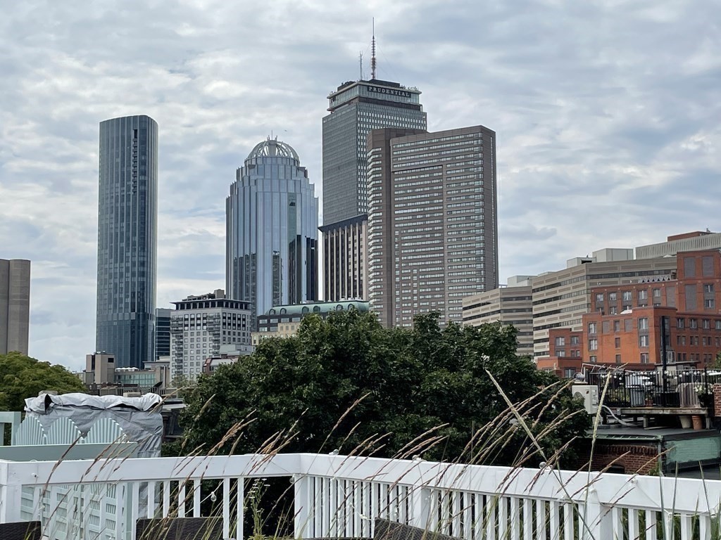 33 Lawrence Street, Unit 2 Boston, MA 02116 - Photo 2 of 38 a front view of a house with a garden