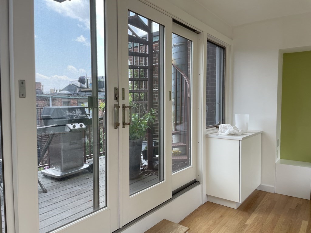 33 Lawrence Street, Unit 2 Boston, MA 02116 - Photo 6 of 38 a bathroom with a glass door shower and a sink