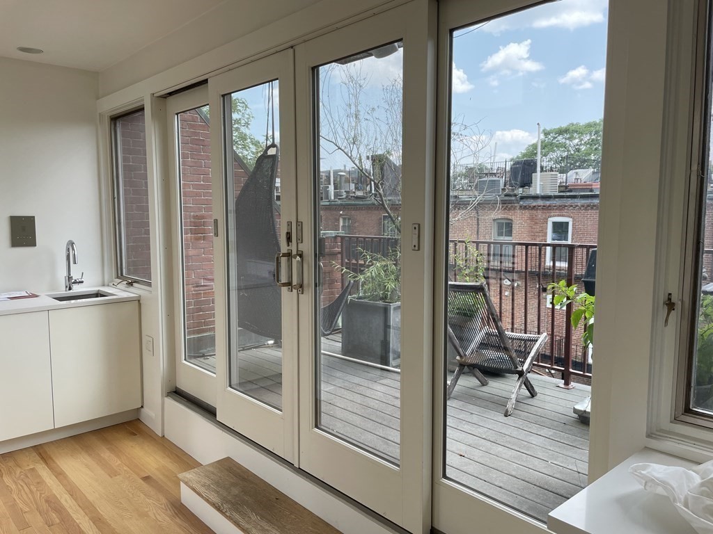 33 Lawrence Street, Unit 2 Boston, MA 02116 - Photo 9 of 38 a view of a living room and a balcony