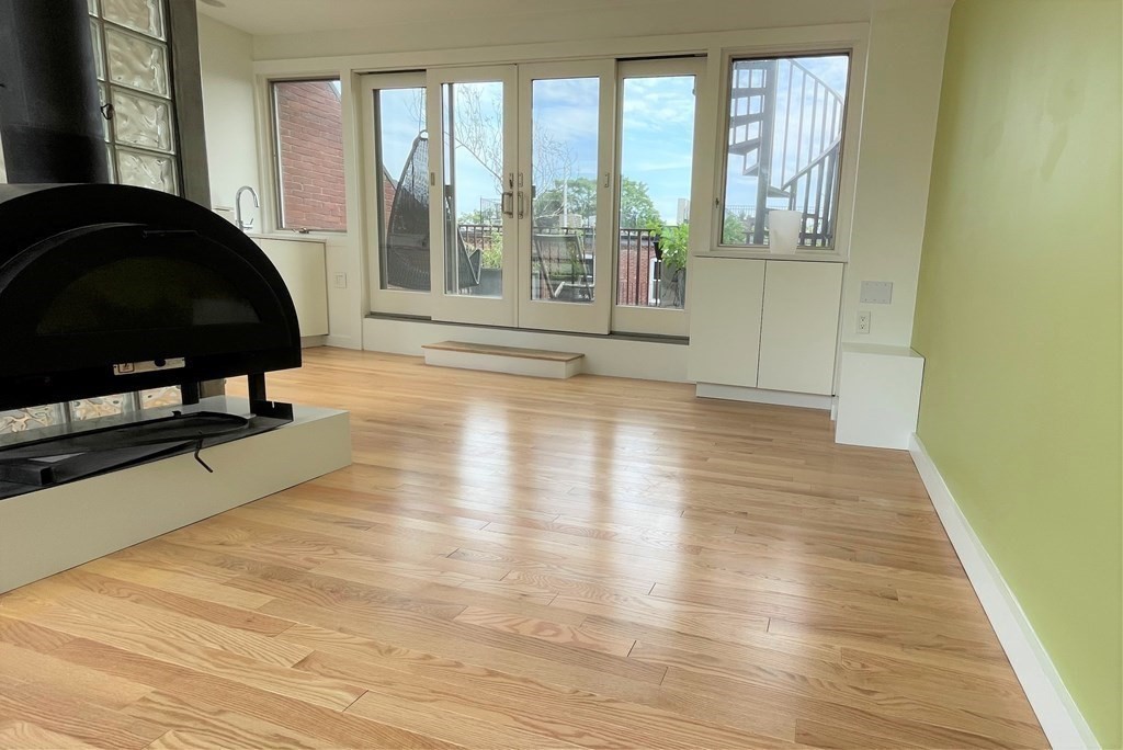 33 Lawrence Street, Unit 2 Boston, MA 02116 - Photo 10 of 38 a view of a floor to ceiling window and a rug