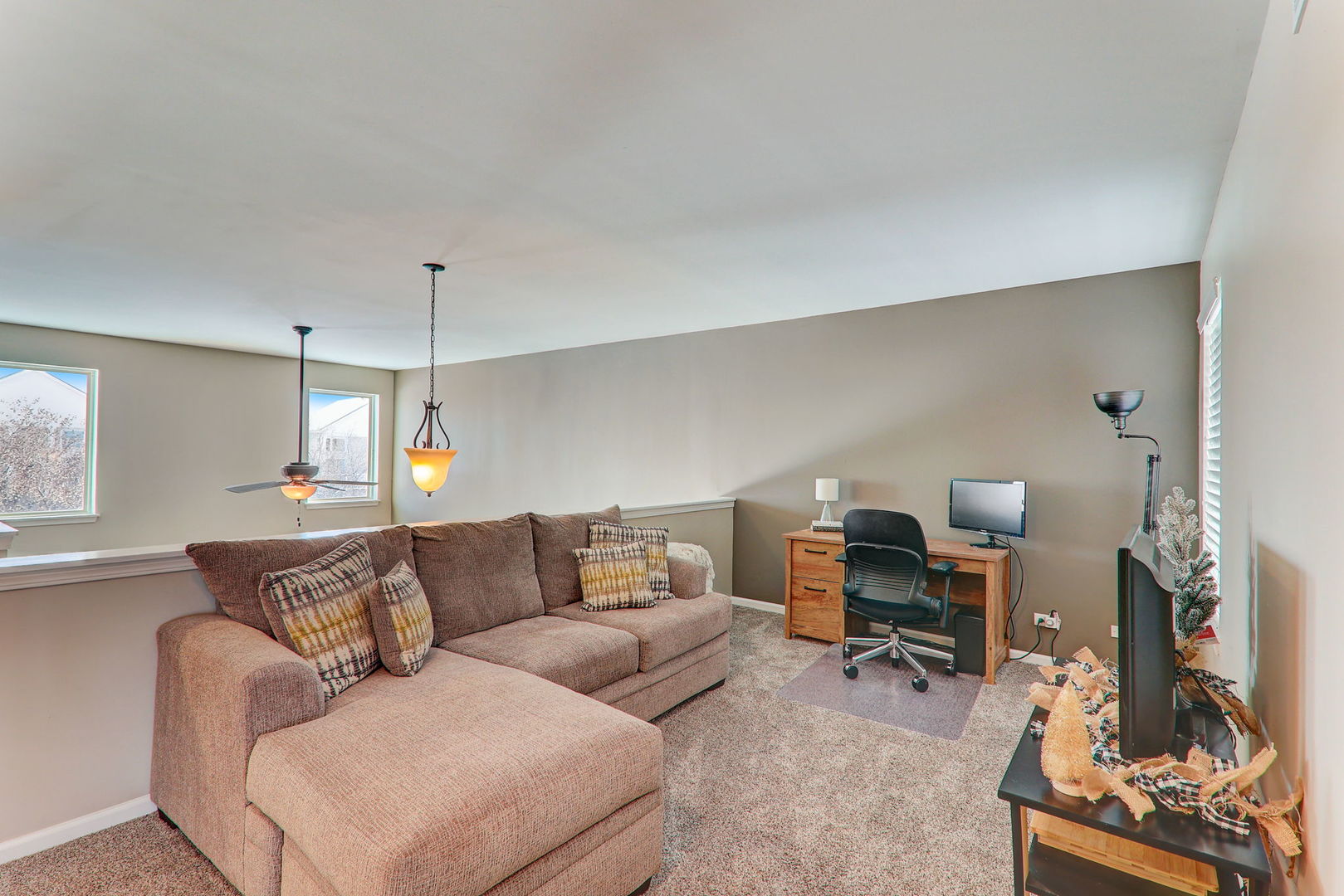 980 Oak Ridge Boulevard Elgin, IL 60120 - Photo 26 of 42 a living room with furniture and a wooden floor