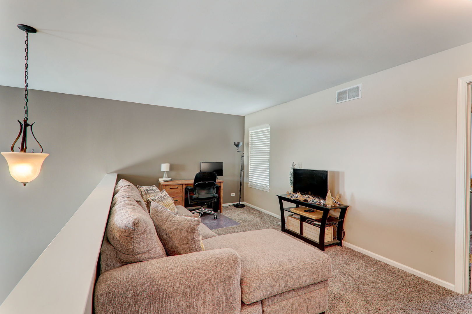 980 Oak Ridge Boulevard Elgin, IL 60120 - Photo 27 of 42 a living room with furniture and a flat screen tv