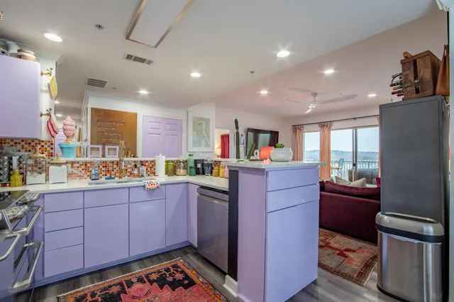 a kitchen with cabinets and appliances